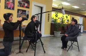 A team from Victory Church films Director of Social Services Margarita Contreras at ACLAMO's Norristown offices.