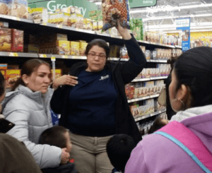 Educators from the Montgomery County Board of Health take ACLAMO adult students to a Walmart Super Center to discuss wise purchasing strategies.